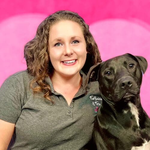 Head of dog training at Furbabies & Friends, Kristie Halveson and her black pitbull Apollo.