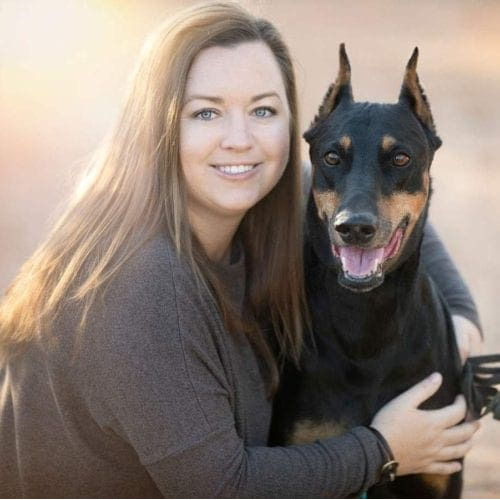 Furbabies & Friends 2022 Fall Family Photoshoot pet parent and her Doberman during her professional family photo shoot in Glendale, AZ.