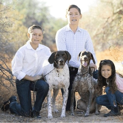 Furbabies & Friends 2022 Fall Family Photoshoot captured children and their two German Shorthair Pointers during professional cute family photos in Glendale, AZ.