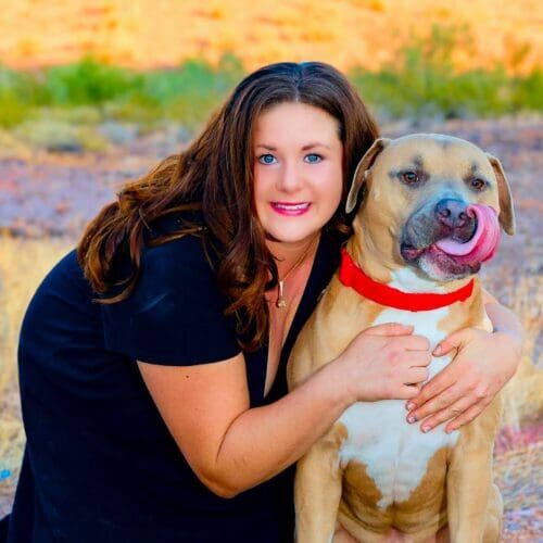 Kristie Halverson, dog trainer in Glendale, AZ, and her American Bully Simba. Kristie Halverson, dog trainer in Glendale, AZ, and her American Bully Simba.