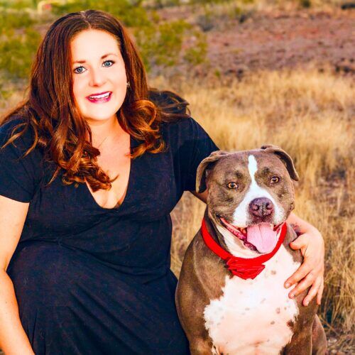Positive reinforcement dog trainer, Kristie Halverson, owner of Furbabies & Friends and her grey XL bully Mix Baloo during a professional pet photography session.