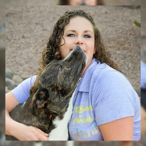 Kristie Halverson and her third foster failure, Tigger, a brindle pitbull cattle dog mix. Kristie Halverson and her third foster failure, Tigger, a brindle pitbull cattle dog mix.