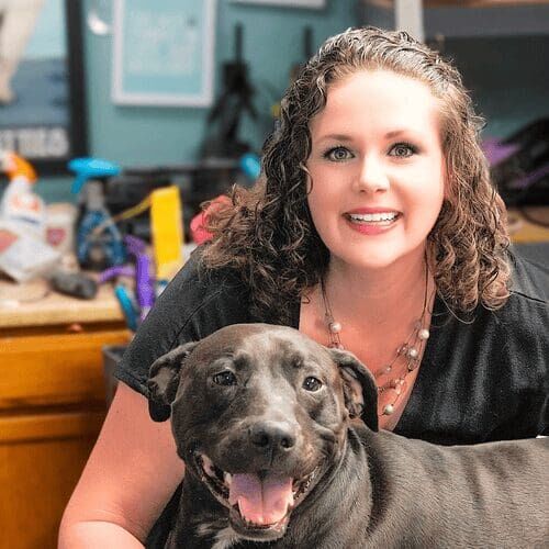 Positive reinforcement dog trainer, Kristie Halverson, owner of Furbabies & Friends and her black pitbull Apollo.