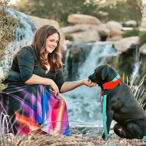 Positive reinforcement dog trainer, Kristie Halverson, owner of Furbabies & Friends and her black pitbull Apollo.