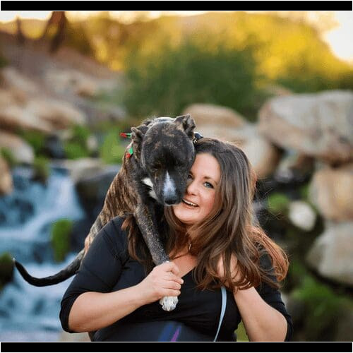Positive reinforcement dog trainer, Kristie Halverson, owner of Furbabies & Friends and her brindled pitbull mix Tigger during a family photoshoot.