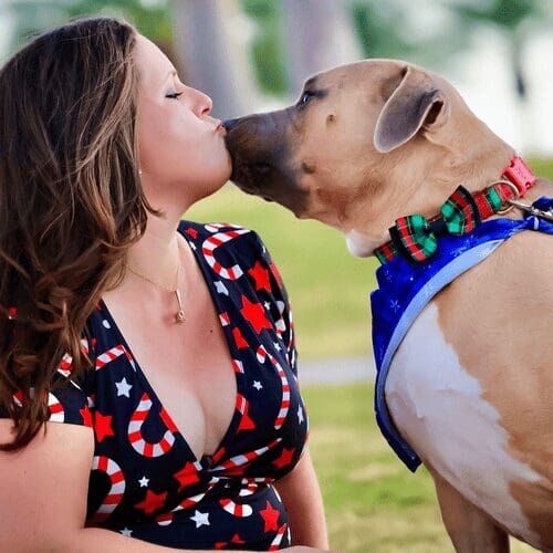 Positive reinforcement dog trainer, Kristie Halverson, owner of Furbabies & Friends and her fawn bully mix Simba during a family photoshoot.