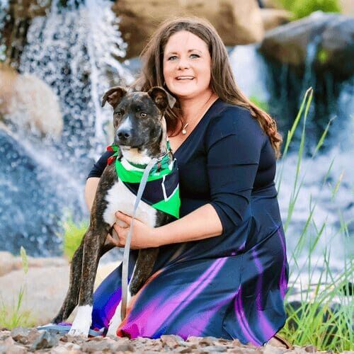Positive reinforcement dog trainer, Kristie Halverson, owner of Furbabies & Friends and her brindled pitbull mix Tigger during a family photoshoot.