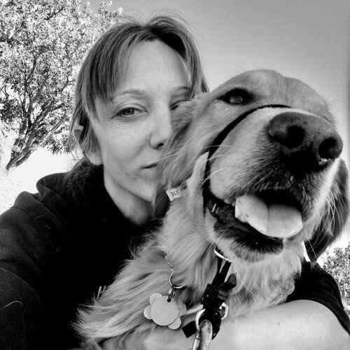 FurBabies & Friends dog walker Sandra hugging Jazzy the Golden Retriever in Arrowhead Ranch AZ