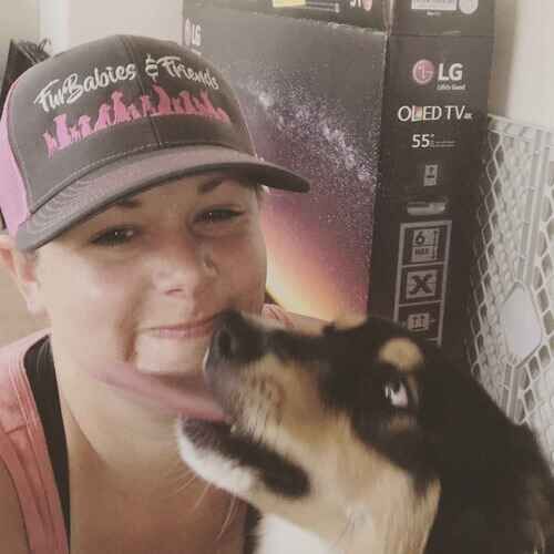 Kristie, owner of FurBabies & Friends, getting kisses from Skye the Aussie during a dog walking visit in Glendale AZ