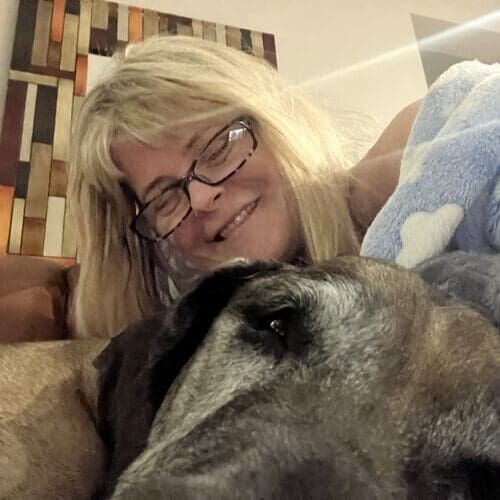 Michelle from FurBabies & Friends snuggling with a Great Dane during overnight dog sitting in Peoria AZ