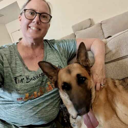 Dog sitter Karen takes selfie with German Shepherd Rocky during pet sitting in Phoenix, AZ