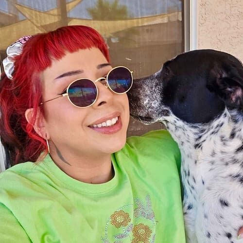 Cattle dog Whisper shares a sweet moment with pet sitter Nina during a potty break in Glendale, AZ