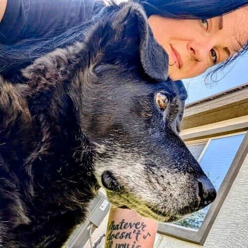 Dog sitter Becca takes selfie with senior black Lab mix Merlin during 24 hour pet care in Surprise, AZ