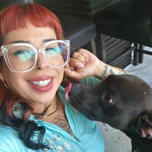 Dog sitter Nina gets kisses from rescue black Lab mix Cino in Surprise, AZ
