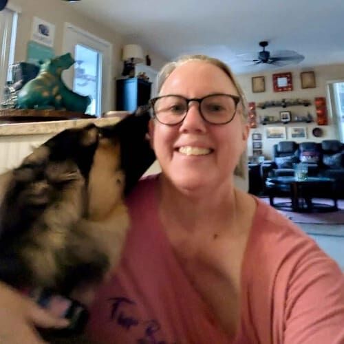 Pet sitter Karen gets kisses from German Shepherd Koda during dog sitting in Glendale, AZ